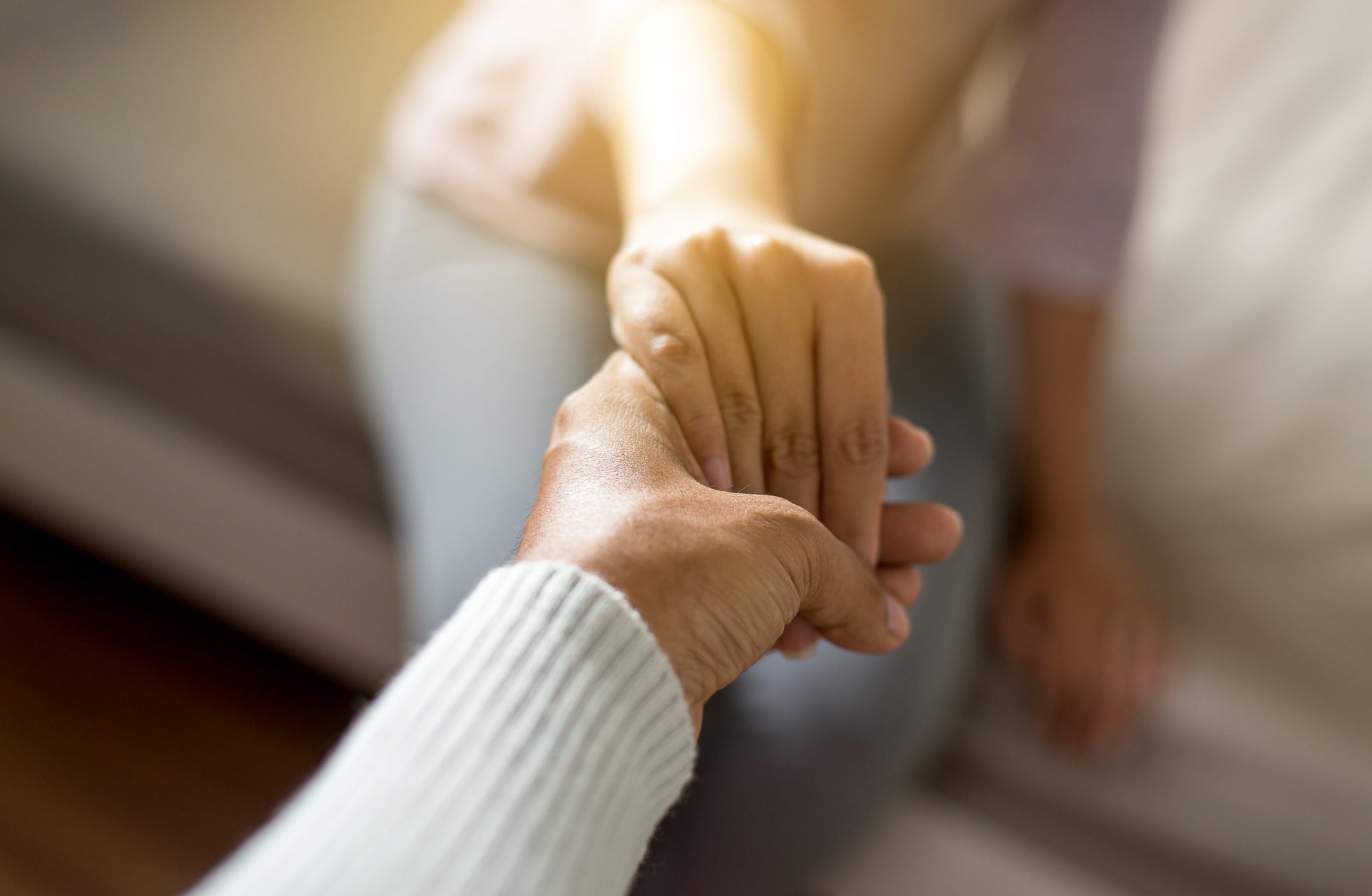 giving hand to depressed woman,